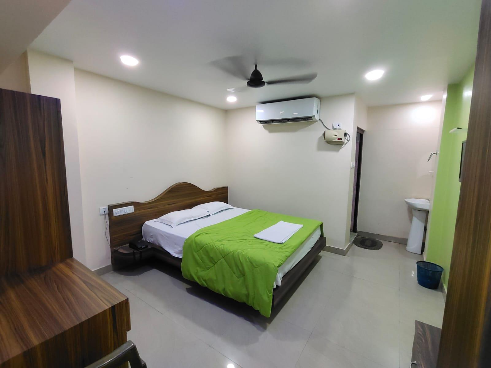Double bedroom with writing desk and wardrobe